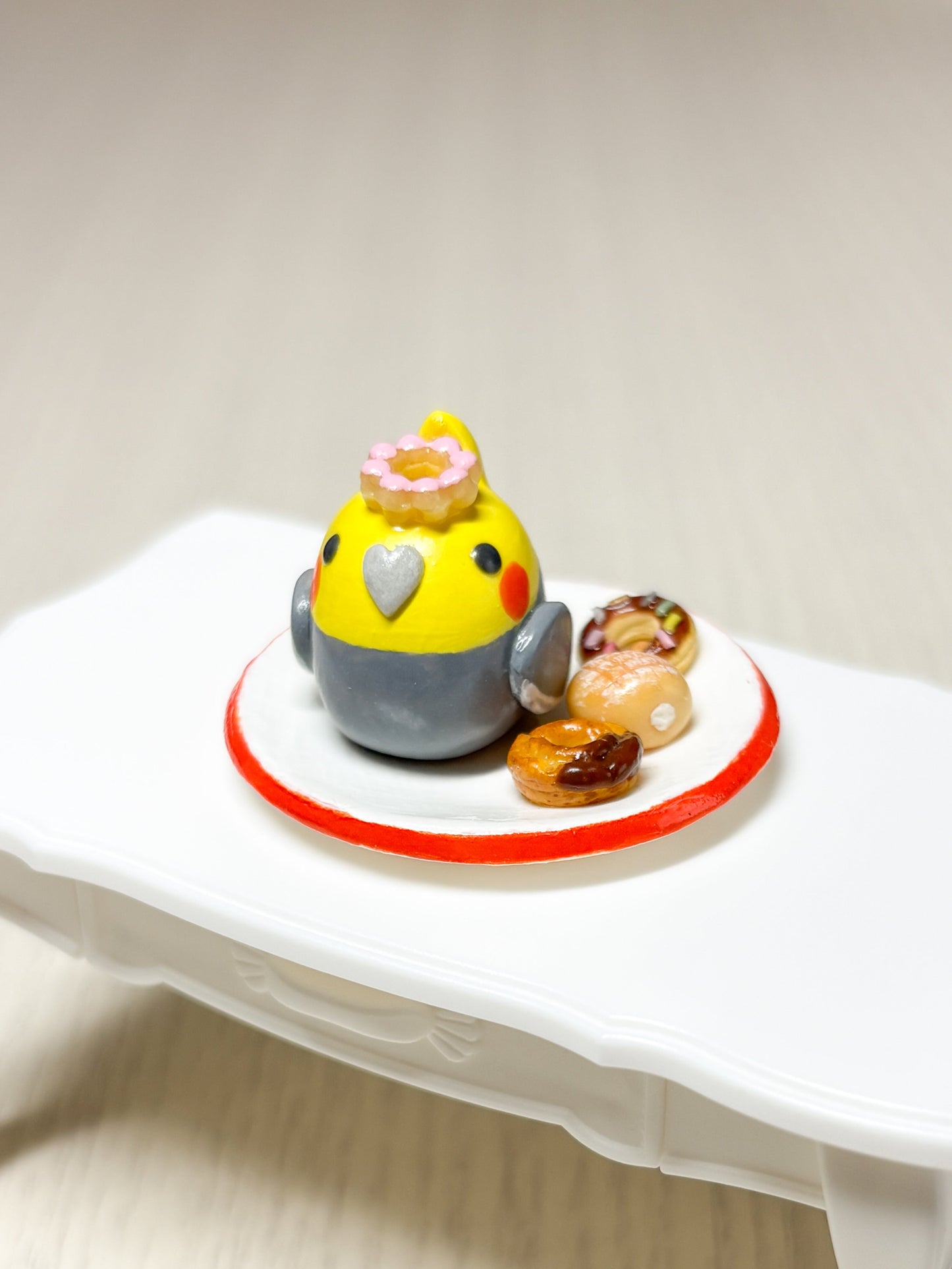 Collectible Miniature Cockatiel with Donuts